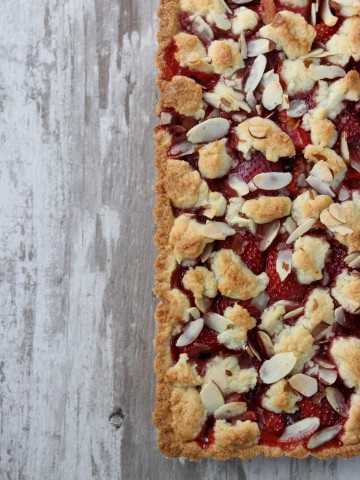 Strawberry almond tart on a wooden surface
