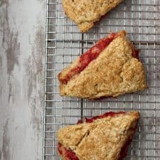 Strawberry rhubarb scones on a cooling rack
