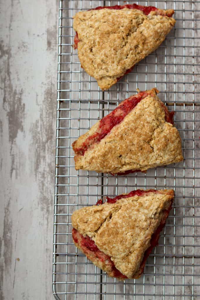 Strawberry rhubarb scones on a cooling rack