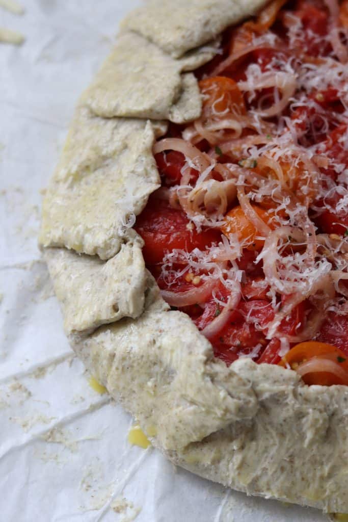 Closeup of an unbaked tomato tart