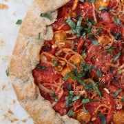 A close up of a rustic tomato tart