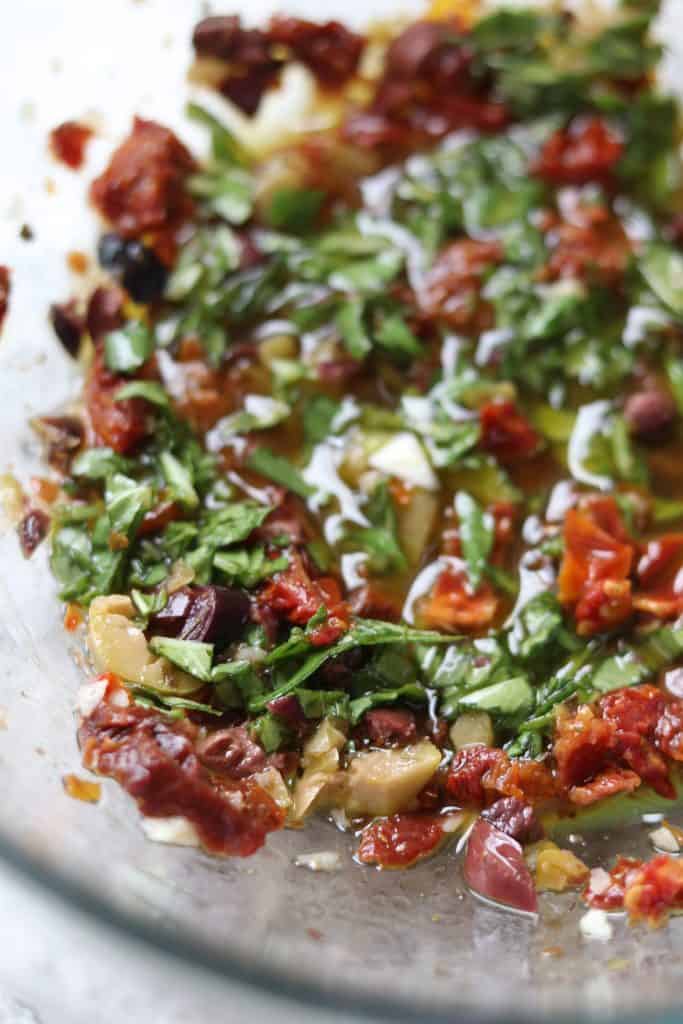 A close up of sun-dried tomato vinaigrette 