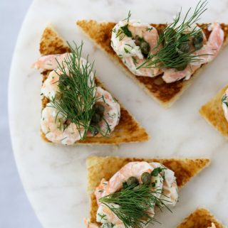 Shrimp salad on toast on a plate