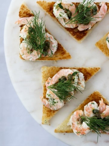 Shrimp salad on toast on a plate