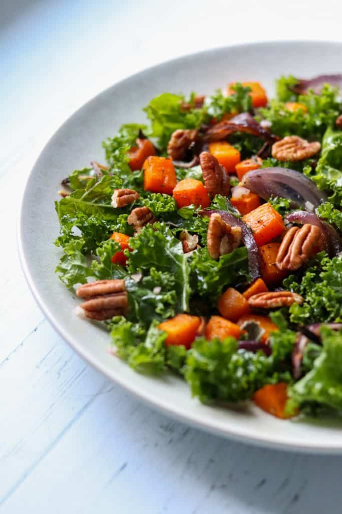 Kale salad with roasted butternut squash and pecans