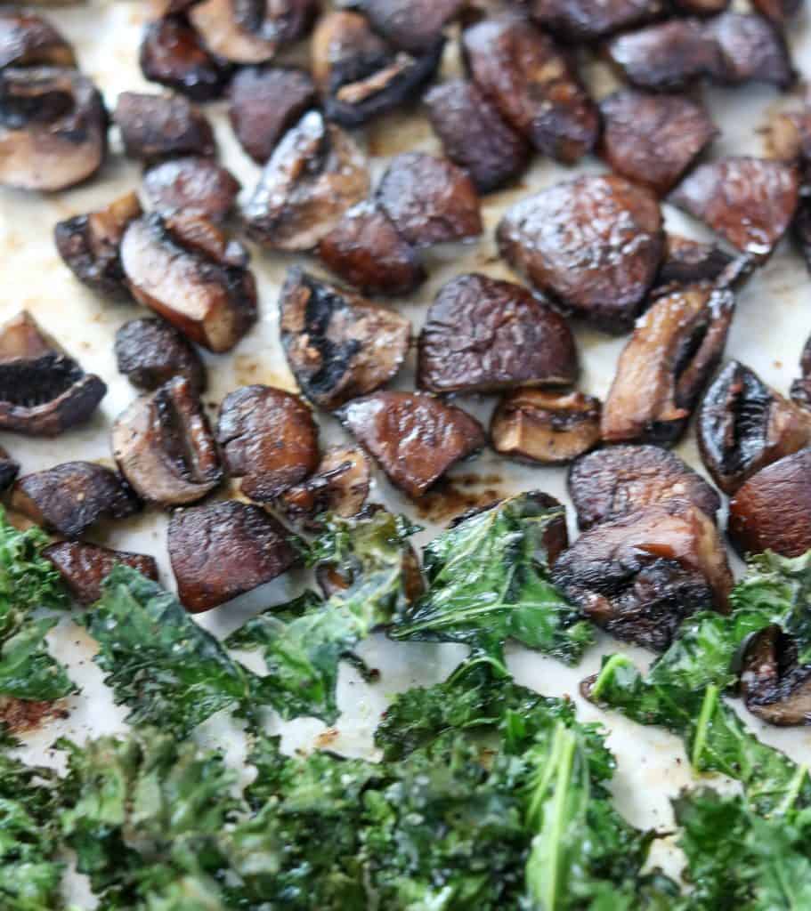 Roasted mushrooms and kale on a sheet pan