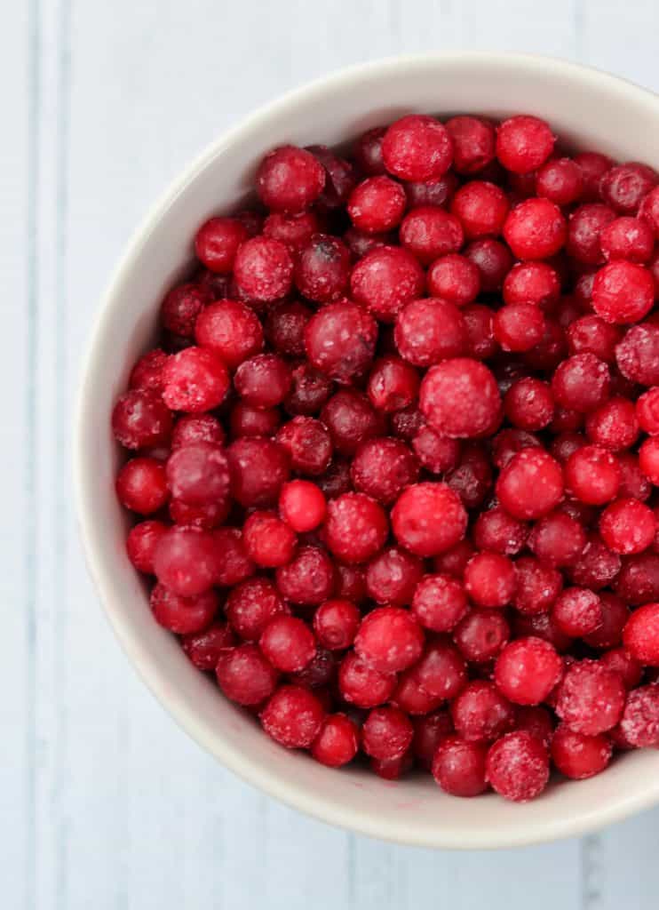 A close up of a bowl of lingonberries