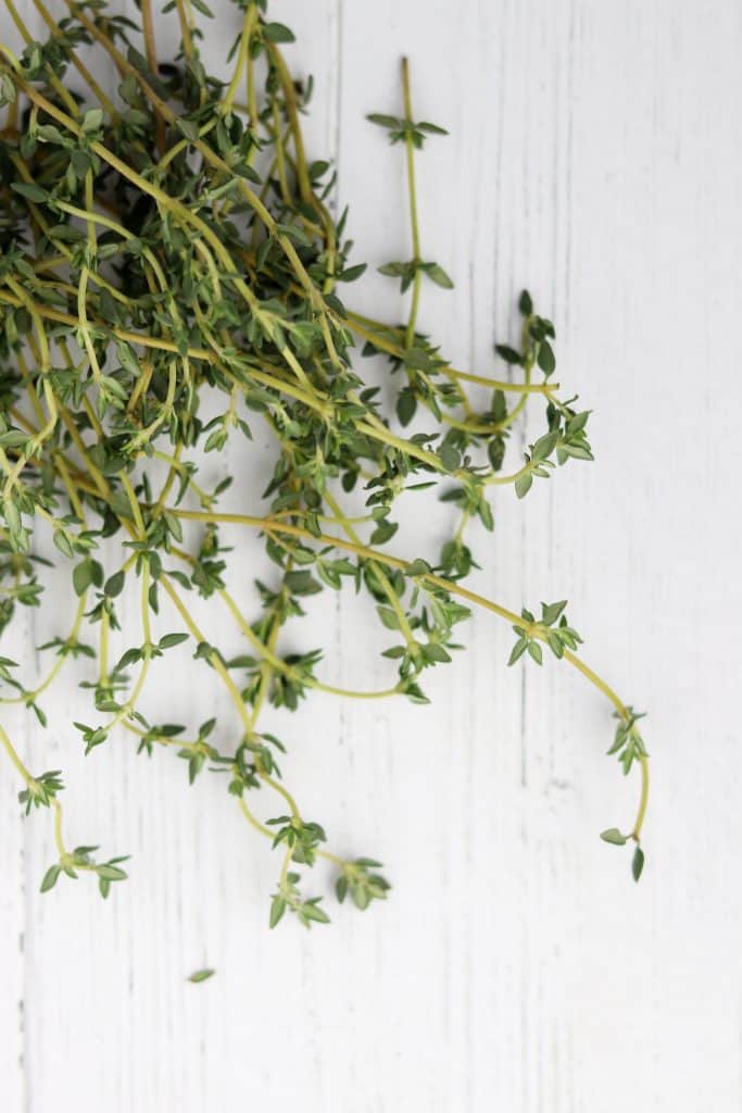 Fresh thyme on a wooden surface