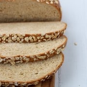 Sliced oat bread on a wooden surface