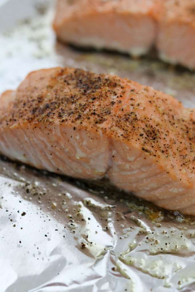 A close up of cooked salmon on foil