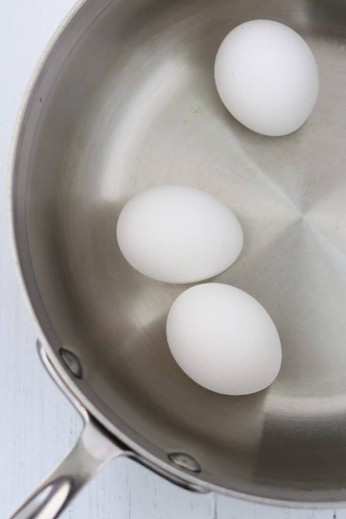 Three eggs in a saucepan