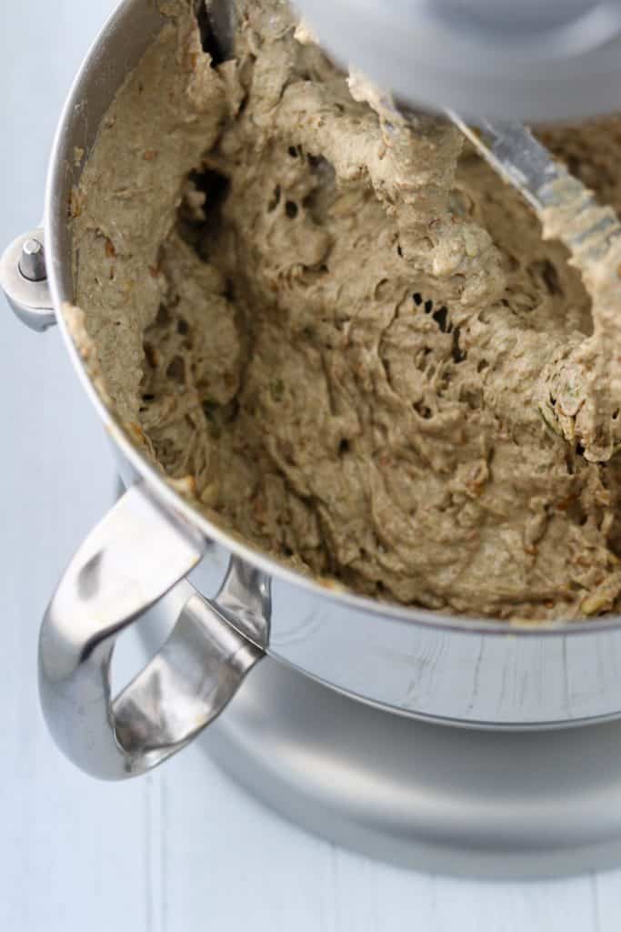 A mixer bowl filled with rye bread dough