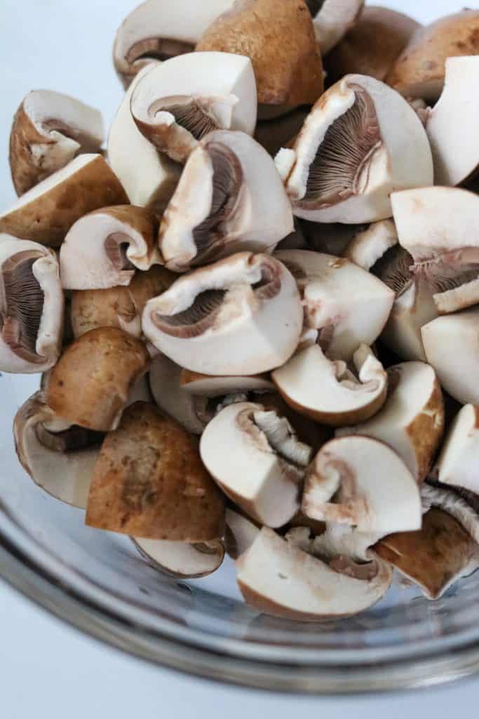 Quartered mushrooms in a bowl