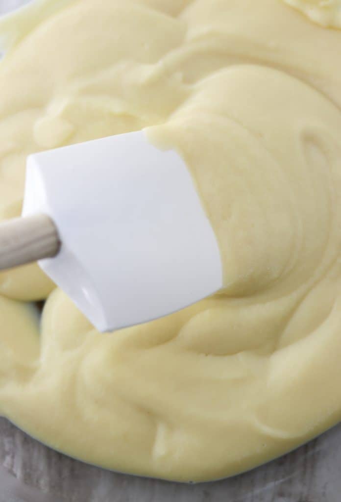 A close up of vanilla pastry cream with a spatula