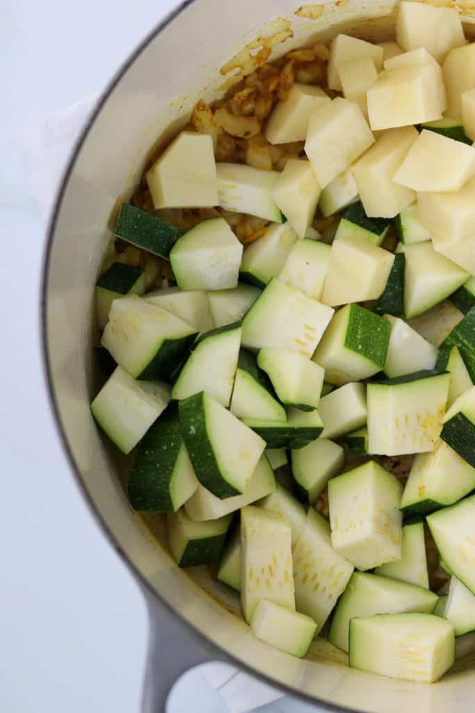 A close up of cut up zucchini and potato