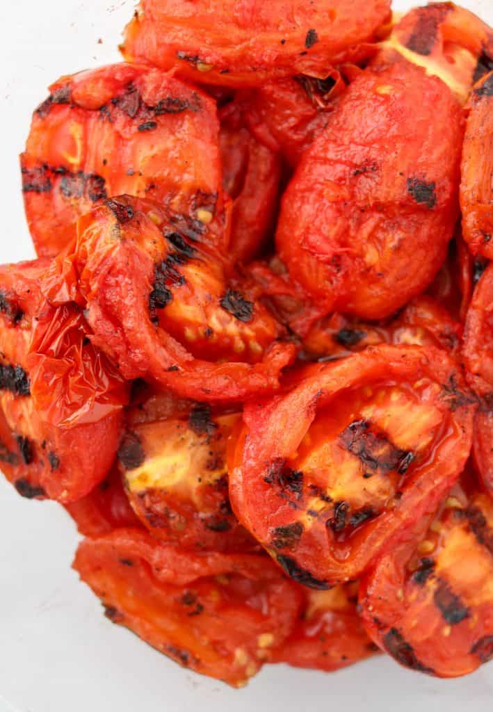 A close up of grilled tomatoes