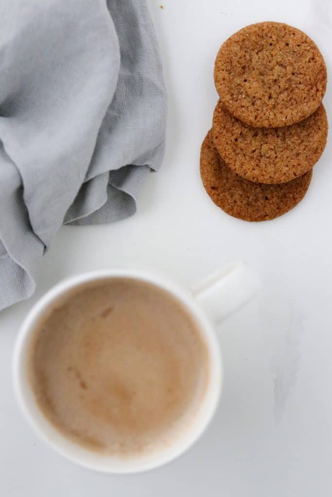 Pumpkin Spice Latte in a mug with gingersnaps