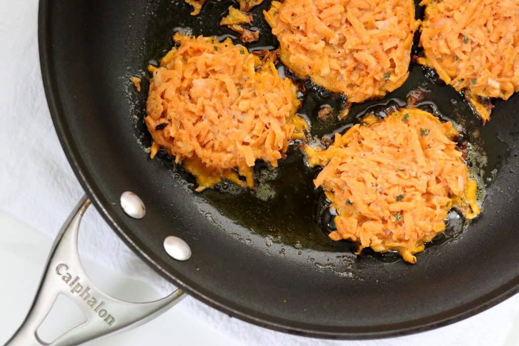 Sweet Potato Pancakes cooking in a pan