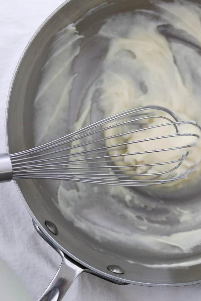 Mixture of water, milk and flour cooked in a pan with a whisk