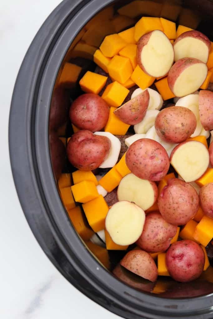 Potatoes, squash and parsnips in a slow cooker
