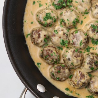 Vegetarian meatballs and cream sauce in a pan
