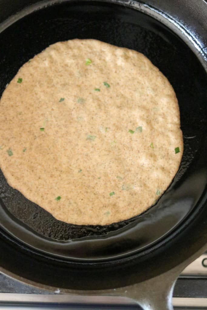 flatbread cooking in a cast iron skillet