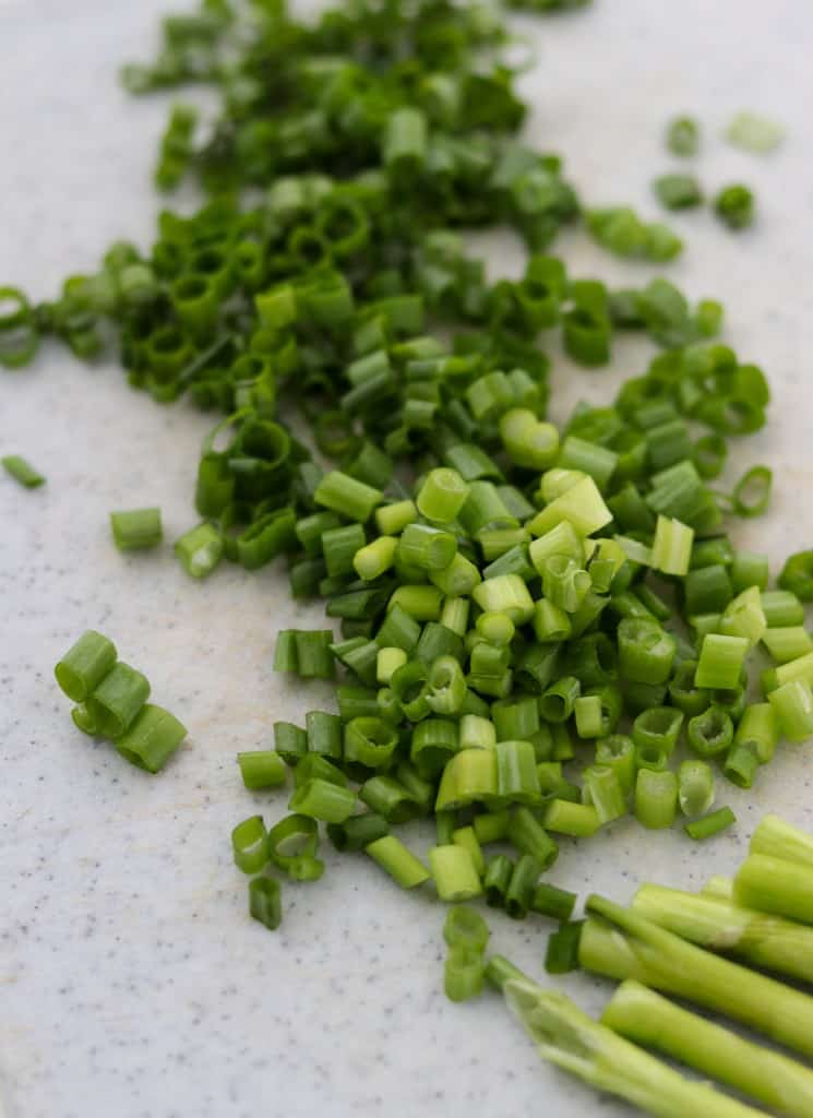 Chopped scallions on a cutting board