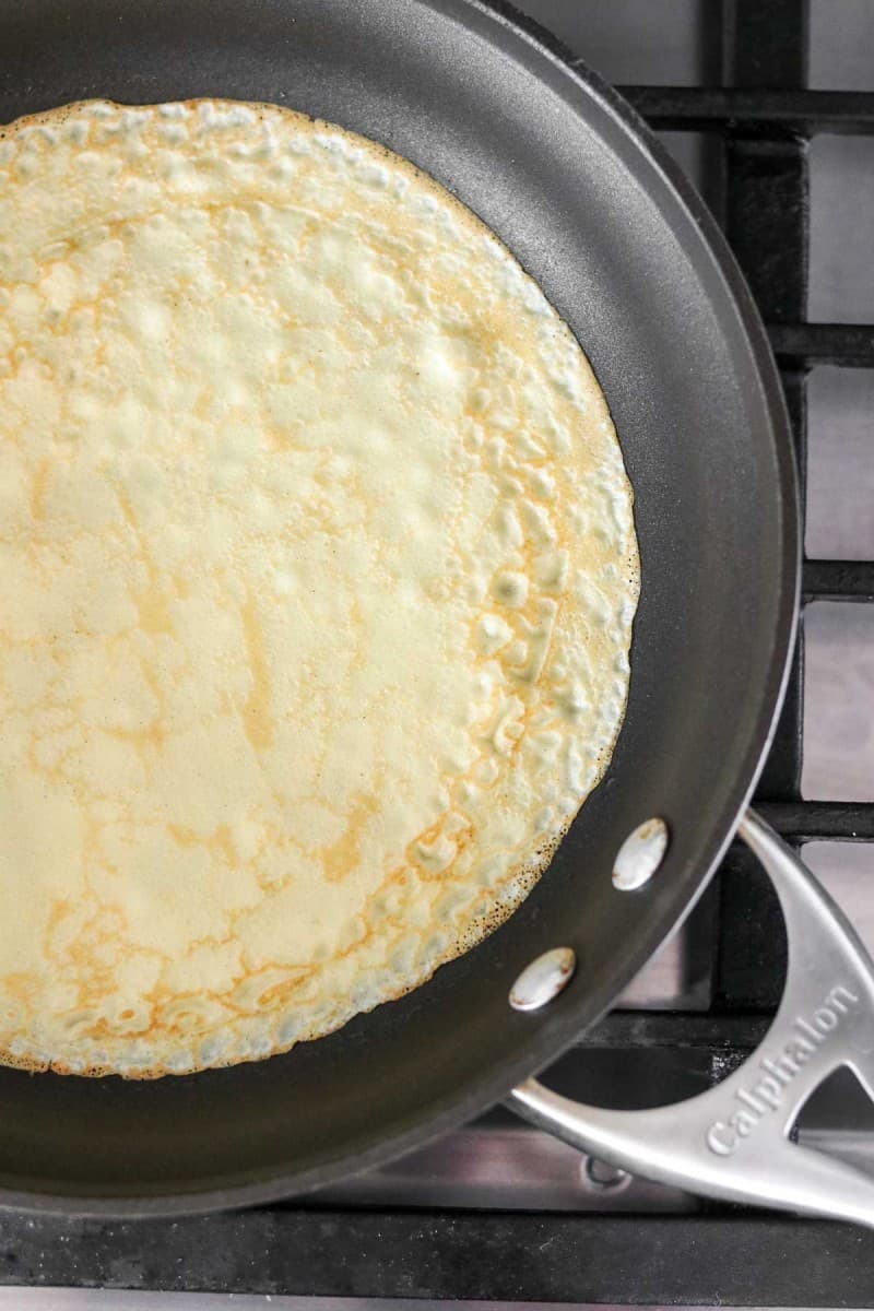 Swedish pancake cooking in a pan.