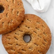 Finnish rye bread rings on a marble surface.