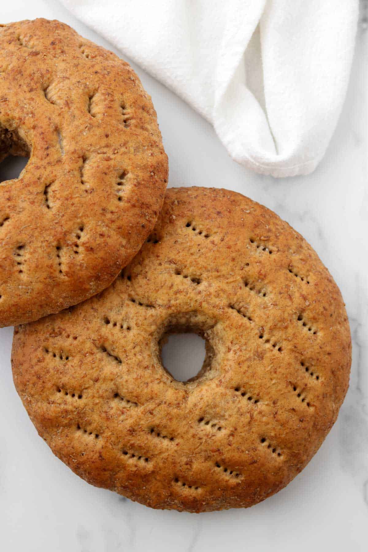 Finnish rye bread rings on a marble surface.