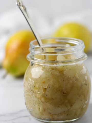 Close up of a glass jar of pear compote.