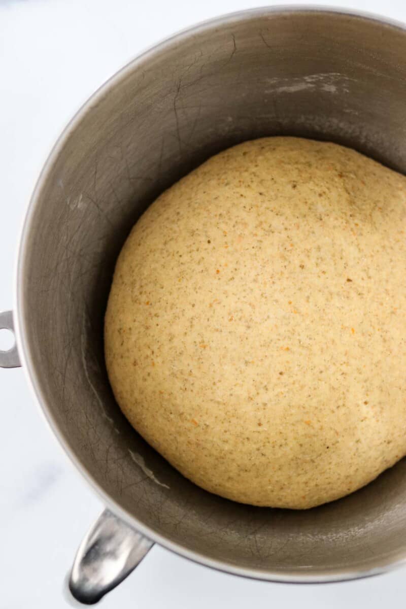 Rye bread dough in a metal bowl.