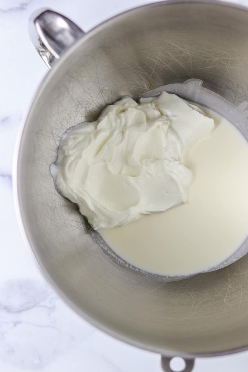 Cream and yogurt in a metal bowl.