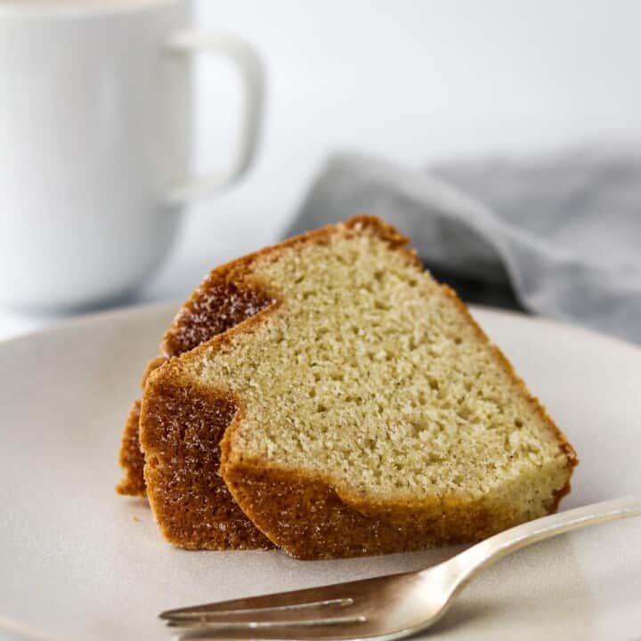 Slice of bundt cake on a plate with a fork.