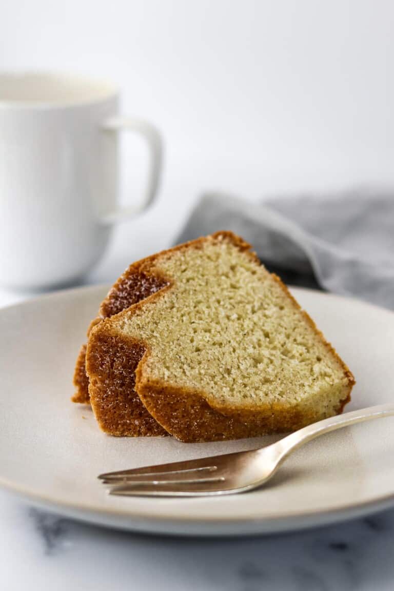 Slice of bundt cake on a plate with a fork.
