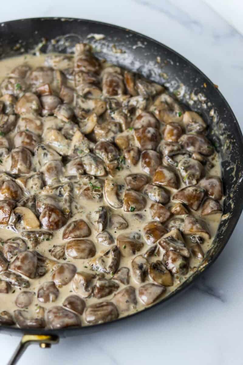 Creamy mushrooms in a skillet.