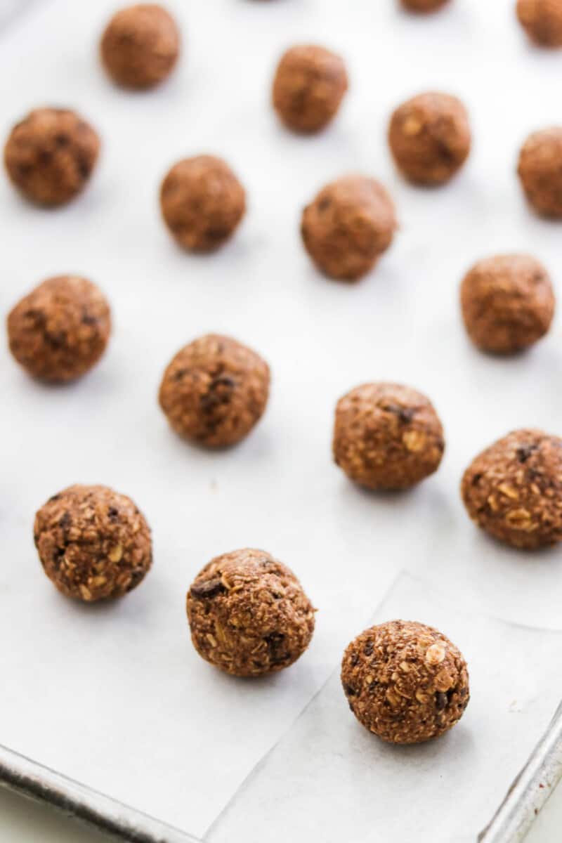 Rolled cookies on a metal sheet pan.