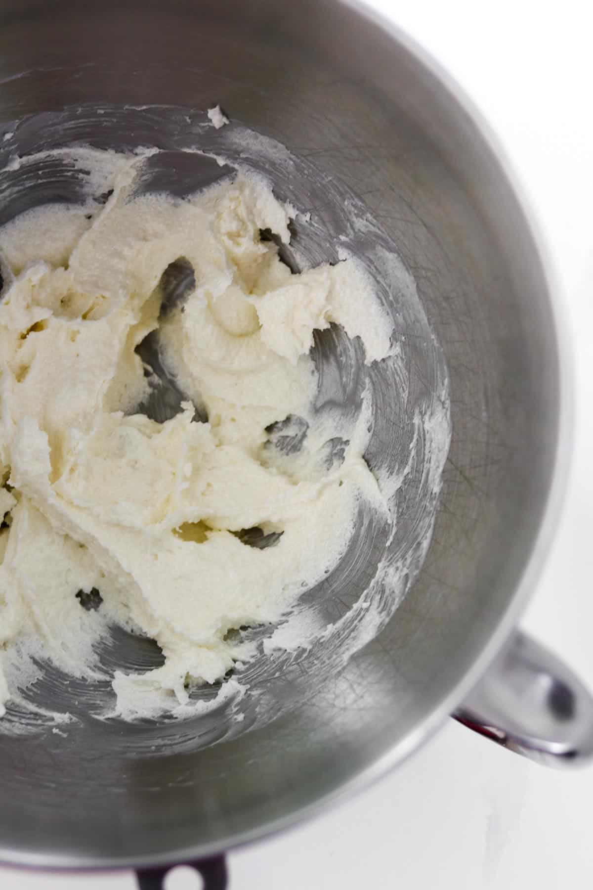 Whipped butter in a metal bowl.