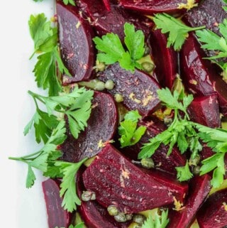 Pickled Beet Salad with Capers, Lemon Zest and Parsley on a platter.