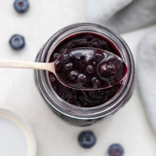 Close up of a spoonful of blueberry cardamom compote.