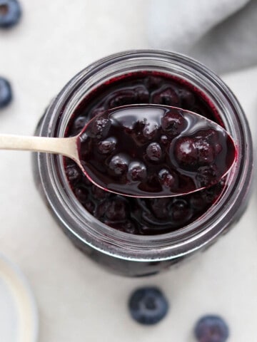 Close up of a spoonful of blueberry cardamom compote.