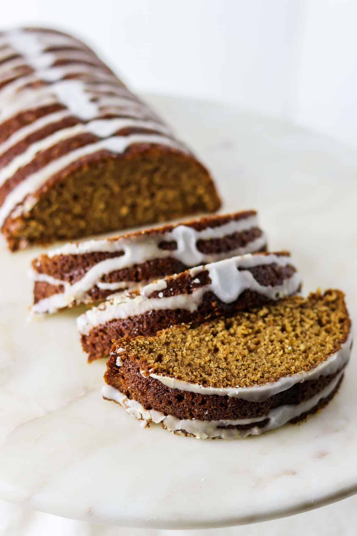 Sliced Swedish Spice Cake on a marble surface.
