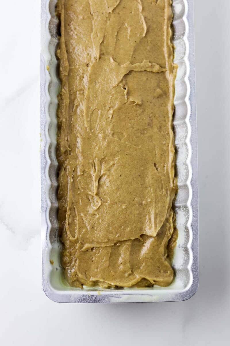 Swedish Spice Cake batter spread in a fluted pan.