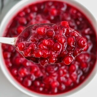 Close up of lingonberry sauce on a spoon.