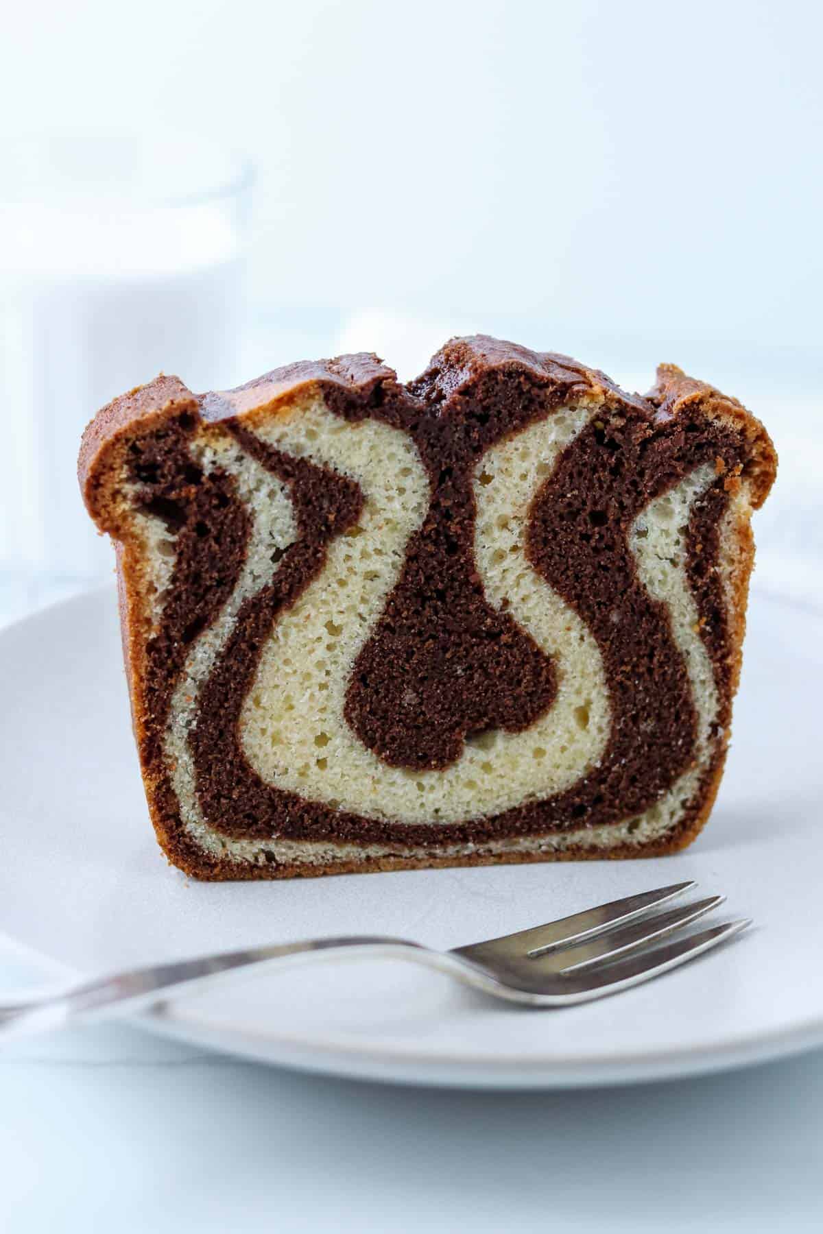 Close up of Swedish Tiger Cake on a plate with a fork.