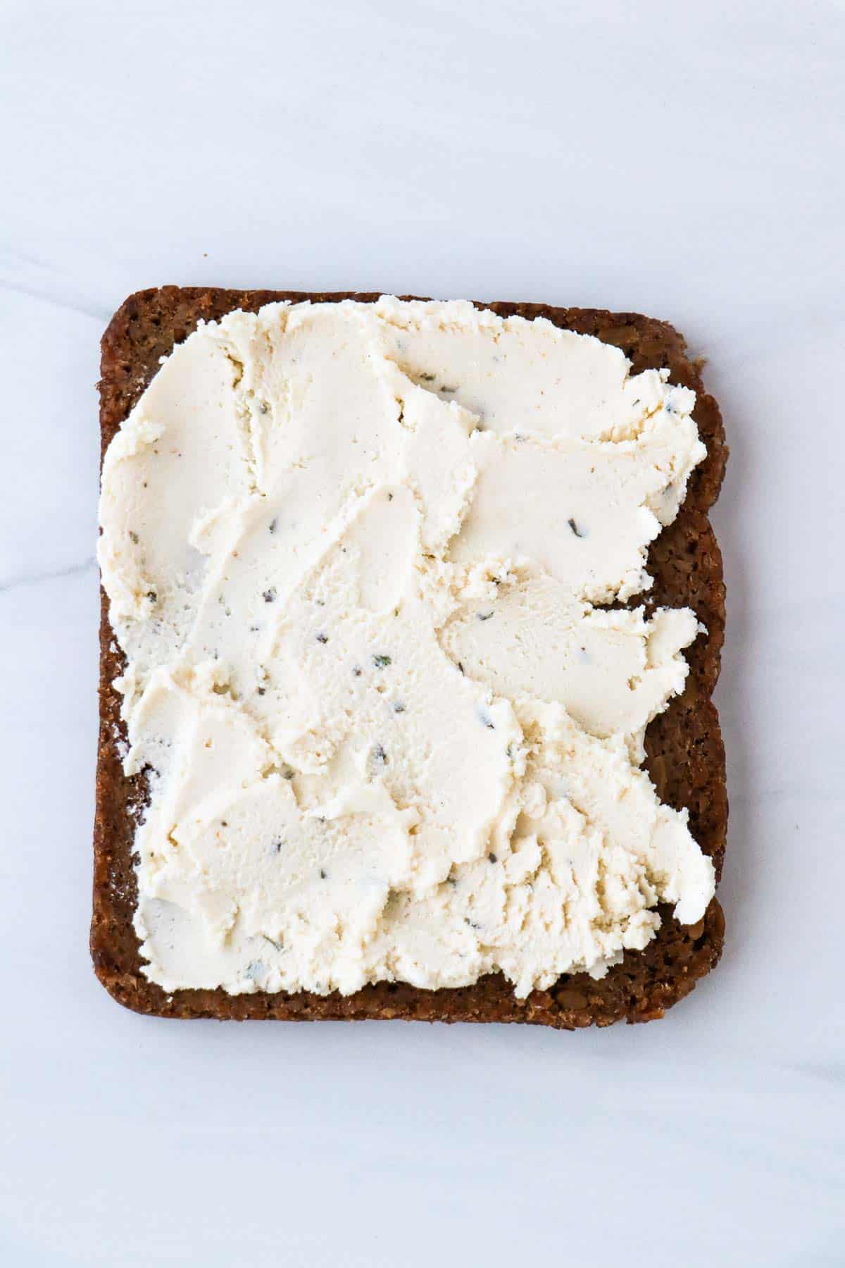 Boursin cheese spread on rye bread.