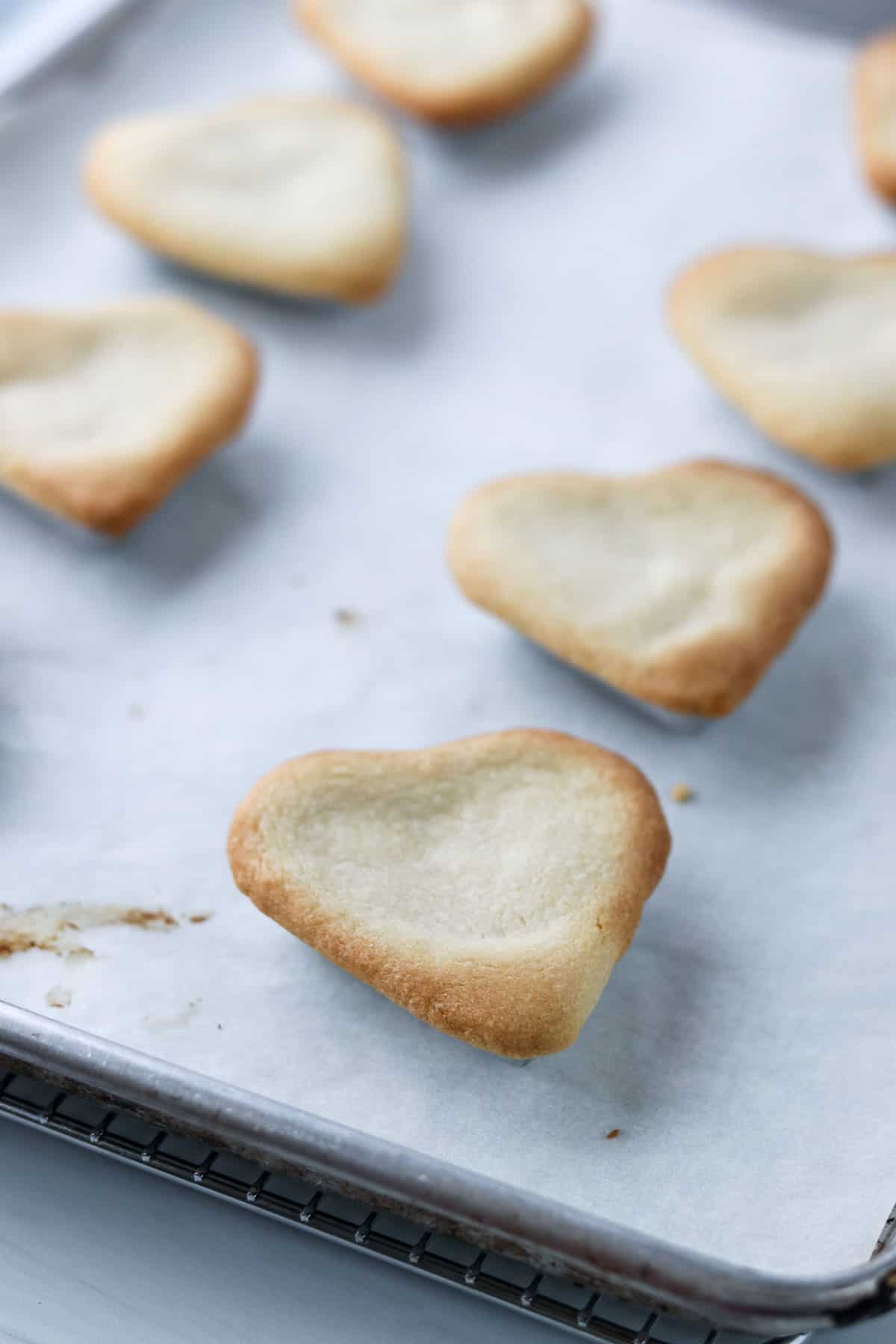 Baked Swedish Custard Hearts on a baking sheet.