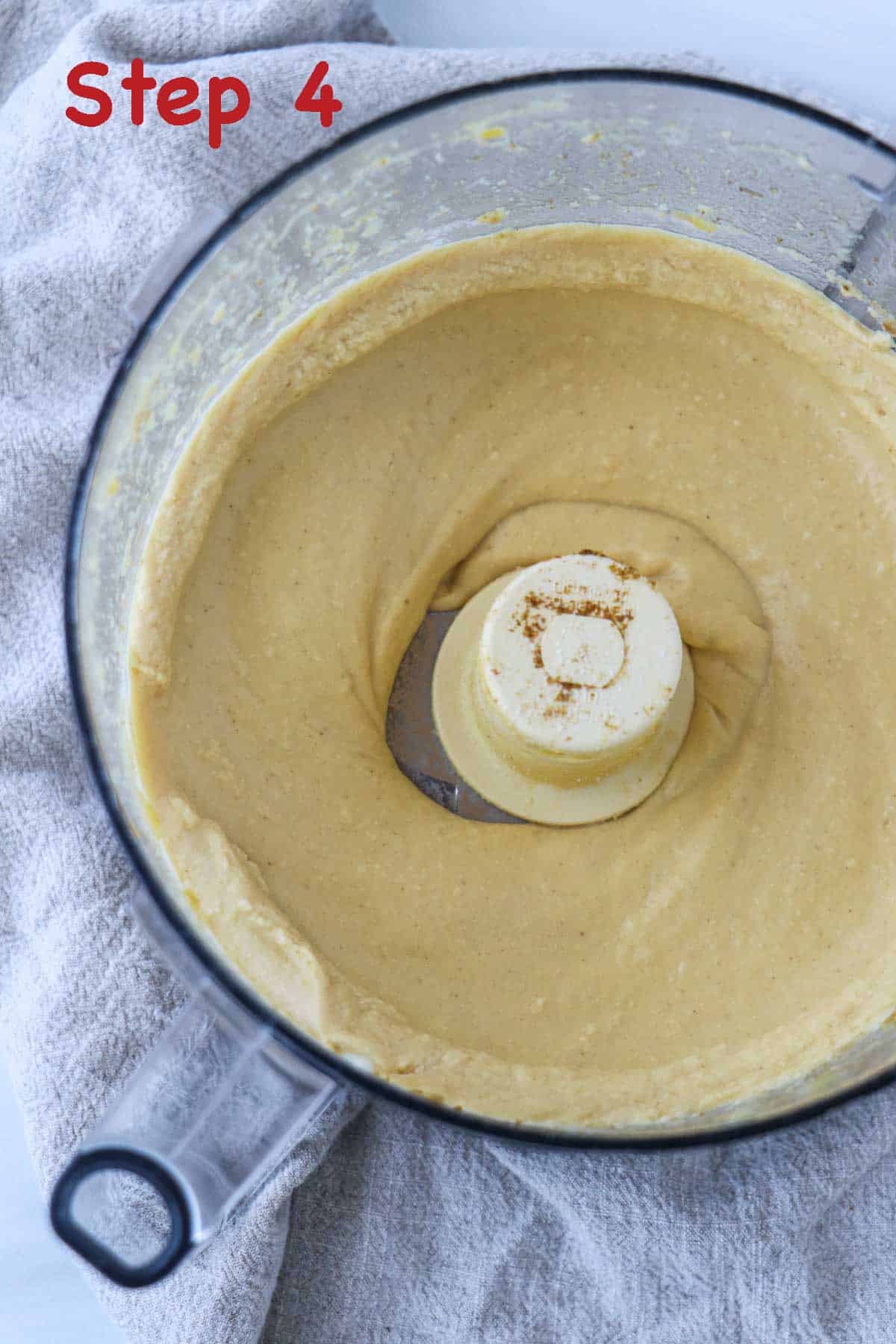 Creamy Split Pea Hummus in the work bowl of a food processor.