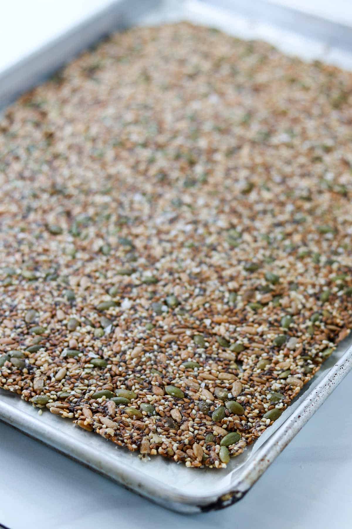 Baked Norwegian Seed Crispbread on a rimmed baking sheet.