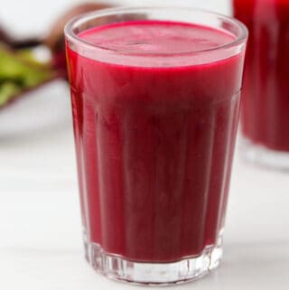 Close up of a glass of beet juice.